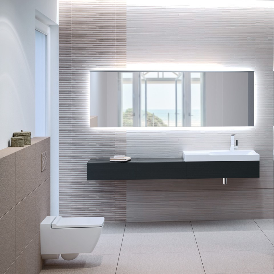 Salle de bains avec WC Rimfree Geberit Xeno², plaque de déclenchement Sigma70 et lavabo