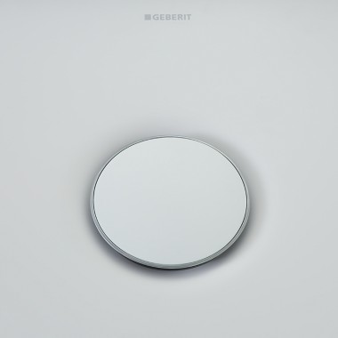 Geberit Olona drain cover surrounded by a slim chrome ring